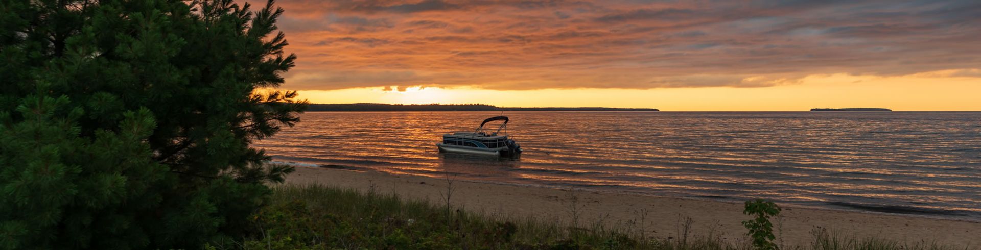 Boat docked at sunset